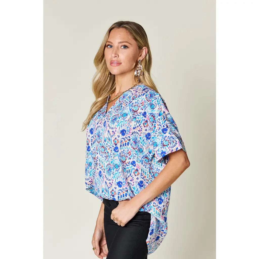 Stay stylish at work and beyond with the Abstractly Mine Printed V-Neck Short Sleeve Blouse. Lightweight breathable