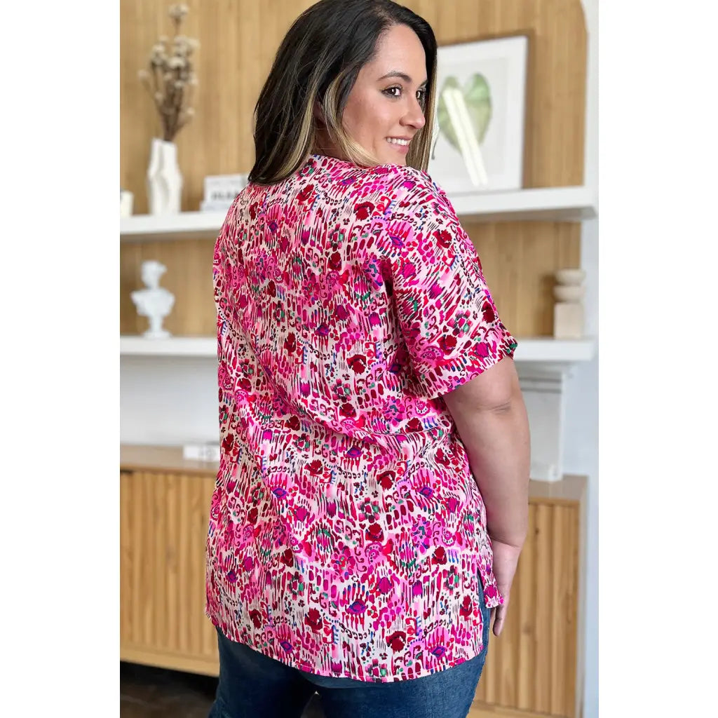 Stay stylish at work and beyond with the Abstractly Mine Printed V-Neck Short Sleeve Blouse. Lightweight breathable