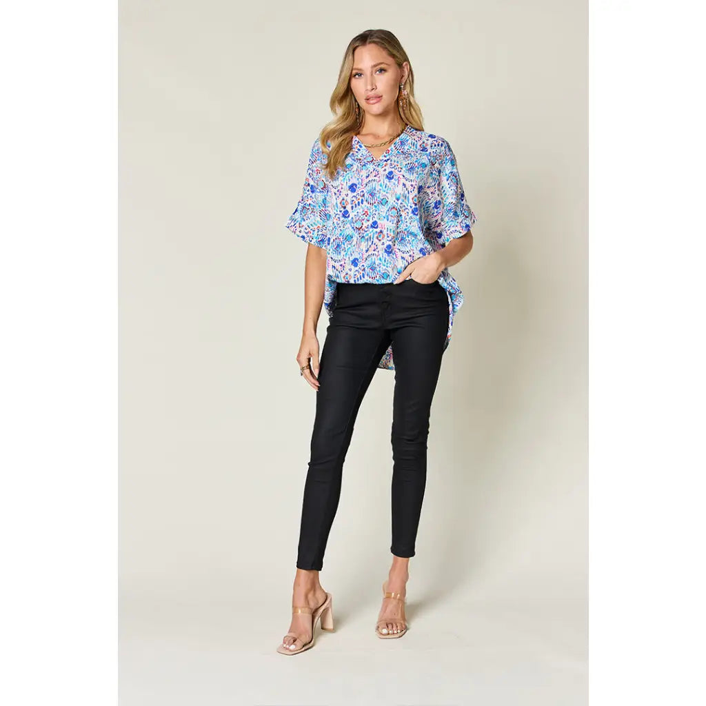 Stay stylish at work and beyond with the Abstractly Mine Printed V-Neck Short Sleeve Blouse. Lightweight breathable