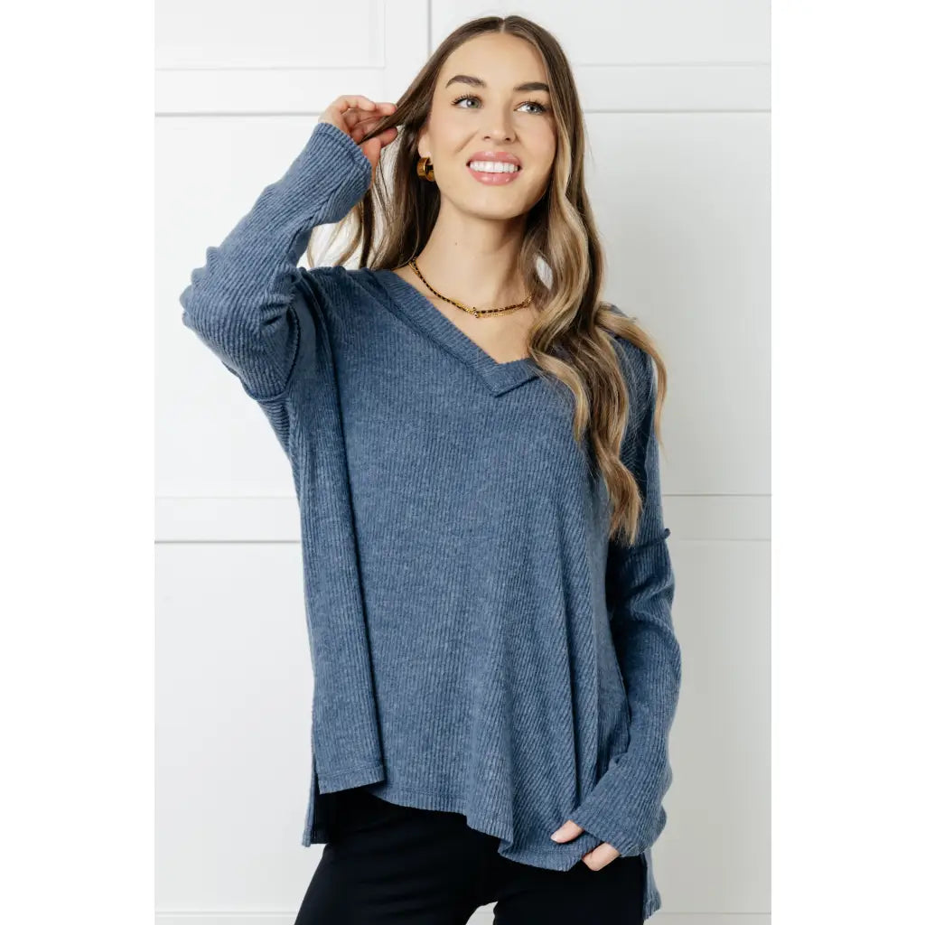 Get ready to cuddle up in our Basically Freezing V-Neck Top Dusty Blue! Its soft brushed hacci fabric and stretchy