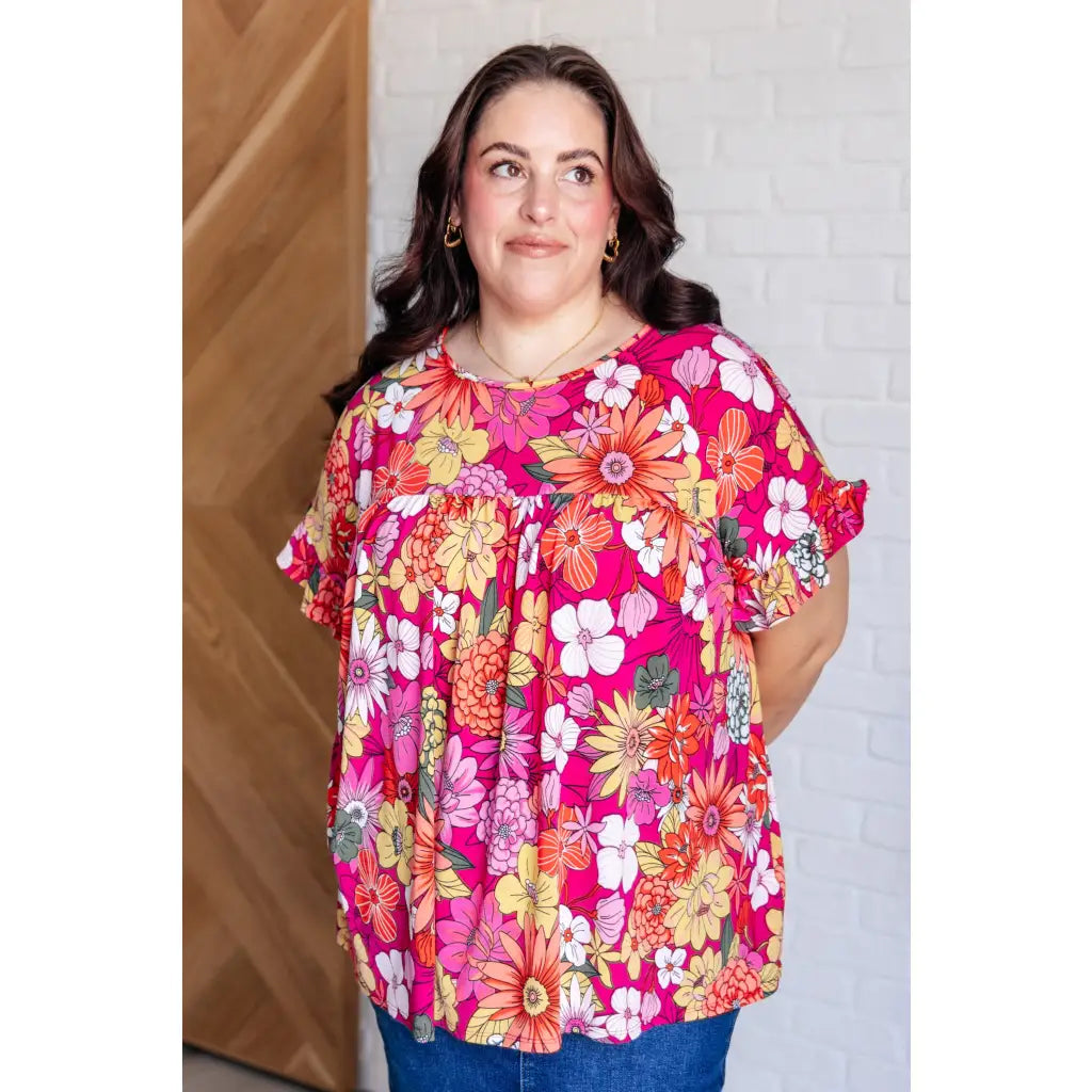 Floral Bulgari knit top with flutter sleeves and a gathered bust. Wrinkle-resistant available in plus sizes up to 3XL