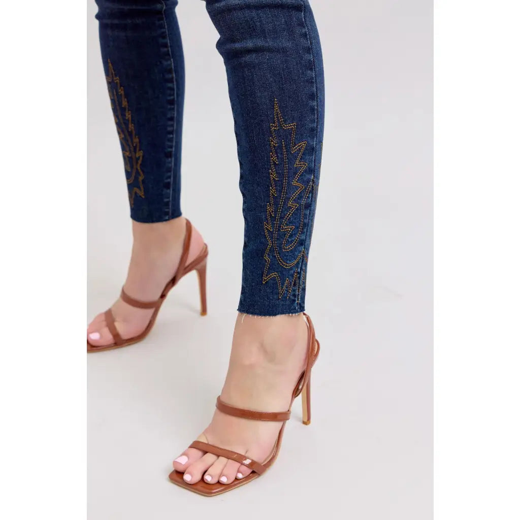 Dark wash Skinny Judy Blue jeans with boot stitch embroidery and high rise fit—chic comfy made to flatter every shape.