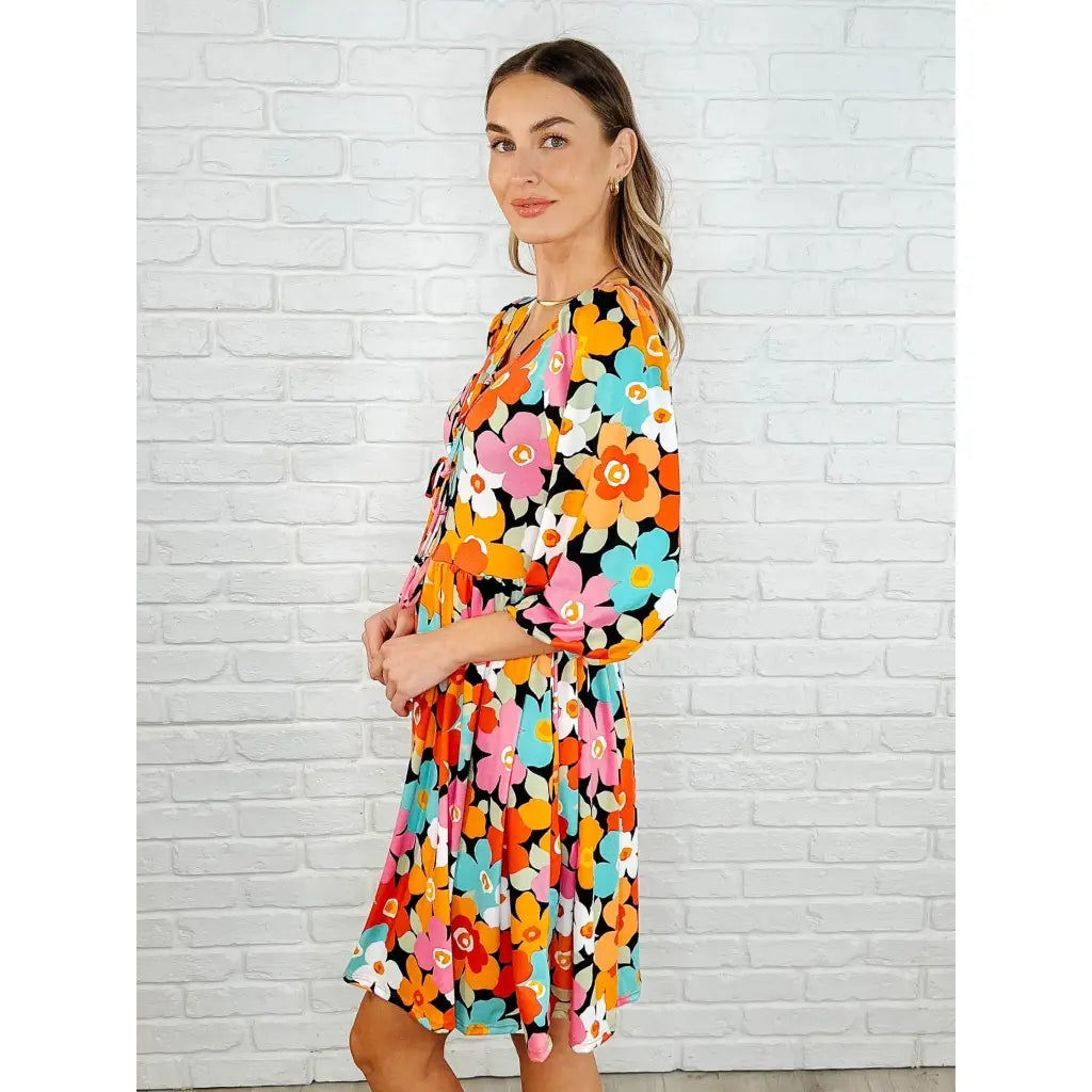 Make a statement in the Bow dly Go V Neck Floral Mini Dress. A bold playful vibrant boutique dress buttery soft fabric