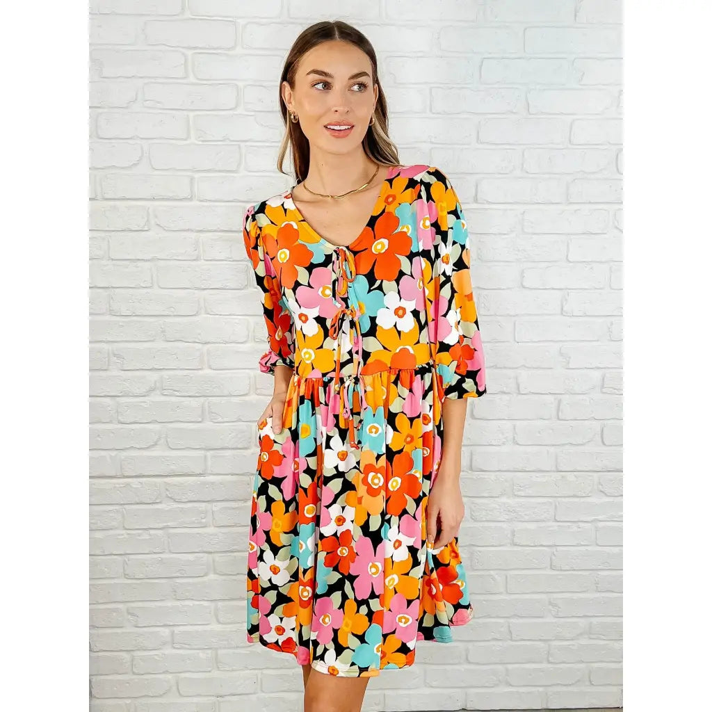 Make a statement in the Bow dly Go V Neck Floral Mini Dress. A bold playful vibrant boutique dress buttery soft fabric