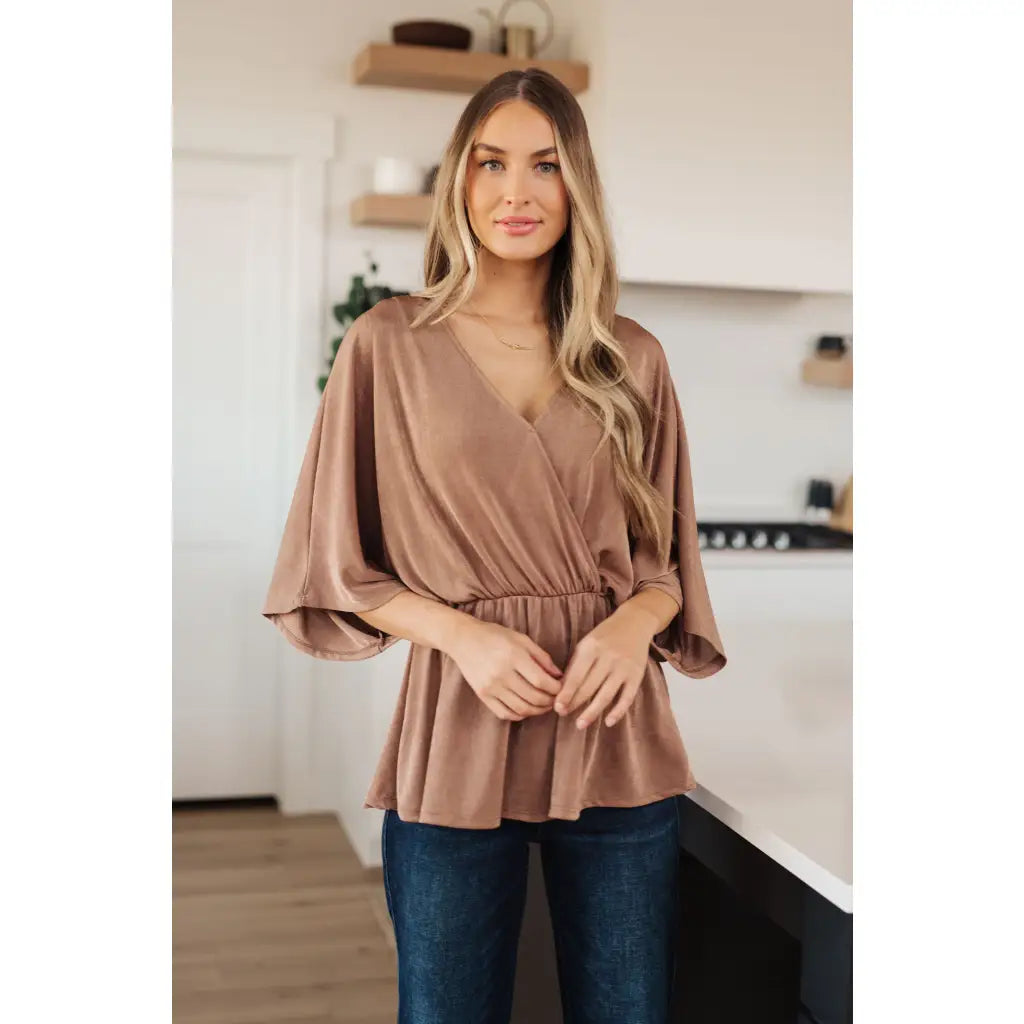 Meet our Bronzed Daze Draped V Neck Blouse! This gorgeous top is constructed from a slinky and shimmering bronze ribbed