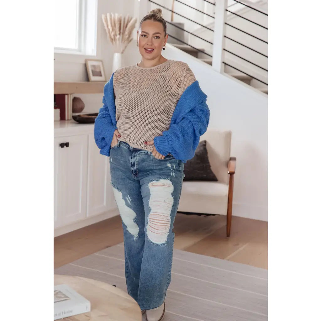 Our Calming Down Loose Knit Top in Beige offers lightweight comfort with its sheer layer and relaxed fit. Designed