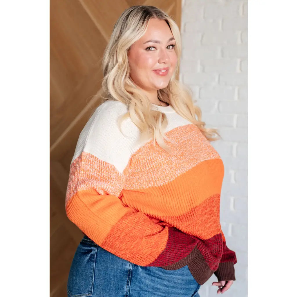 Our Candy Corn Color Block Wide Striped Sweater features a round neckline that adds touch of charm while the drop