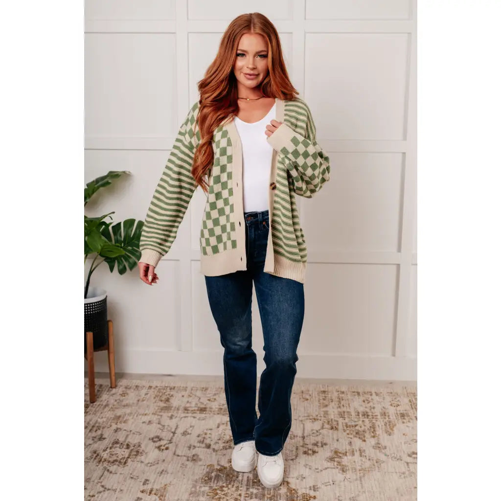 Stay cozy and stylish in our Check the Stripes Knit Cardigan Olive. This versatile piece features a flattering