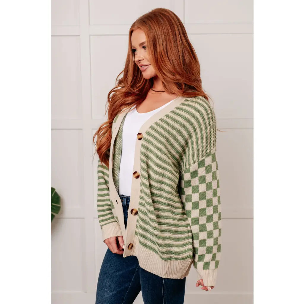 Stay cozy and stylish in our Check the Stripes Knit Cardigan Olive. This versatile piece features a flattering