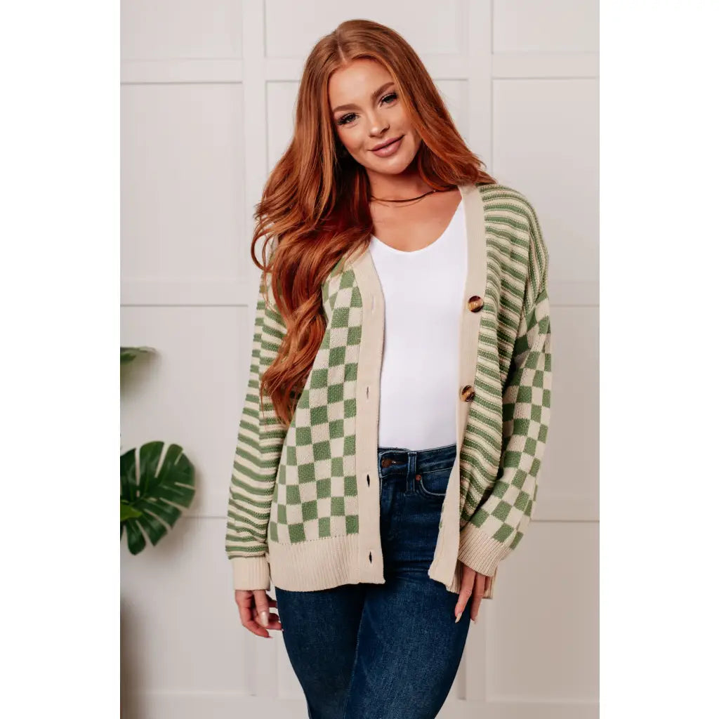 Stay cozy and stylish in our Check the Stripes Knit Cardigan Olive. This versatile piece features a flattering