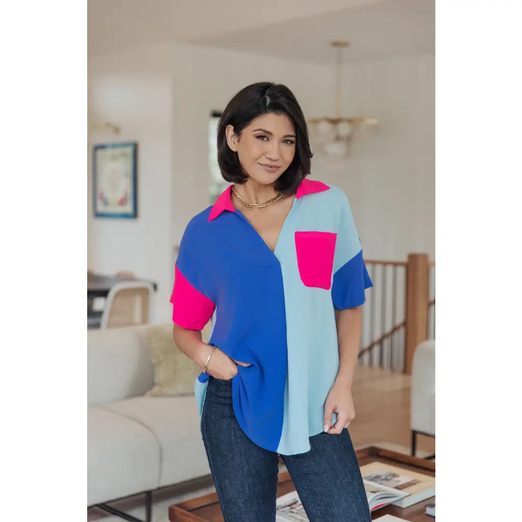 Stand out in the Color Pop Confidence Blouse! Bold color blocking a relaxed fit and luxe style — perfect top
