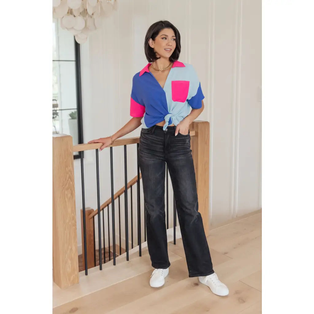 Stand out in the Color Pop Confidence Blouse! Bold color blocking a relaxed fit and luxe style — perfect top