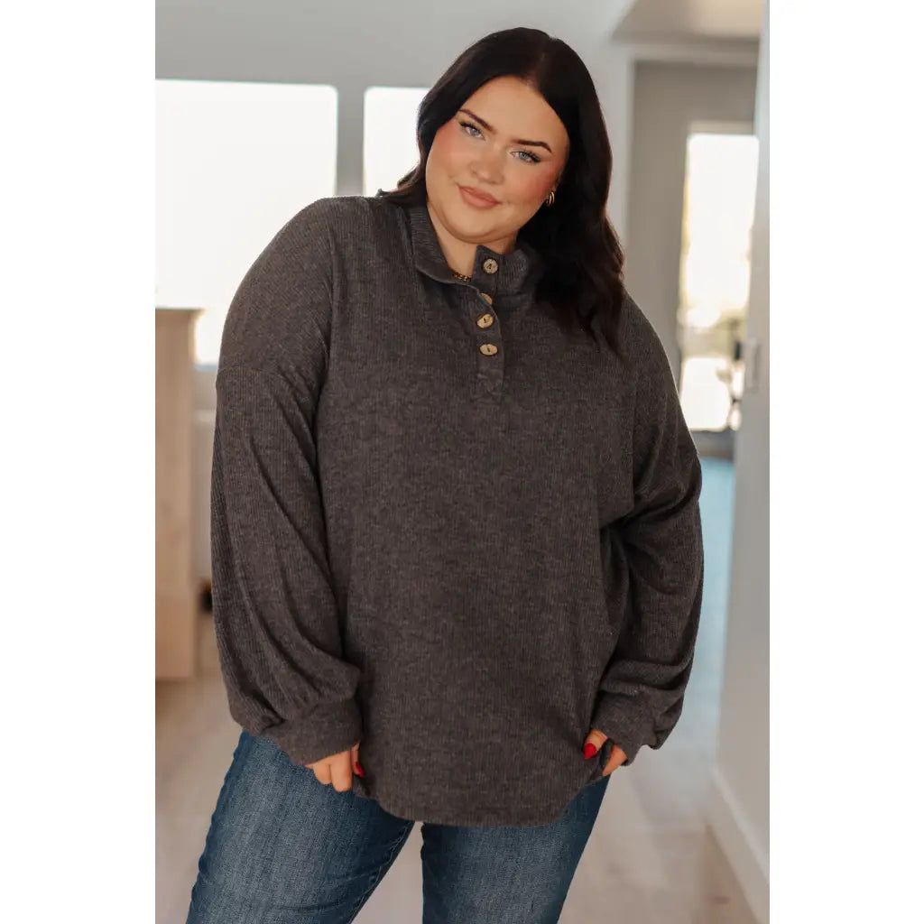 The Cozy All Over Henley Top in Cocoa is soft stylish and chic featuring a brushed ribbed knit mock neckline relaxed