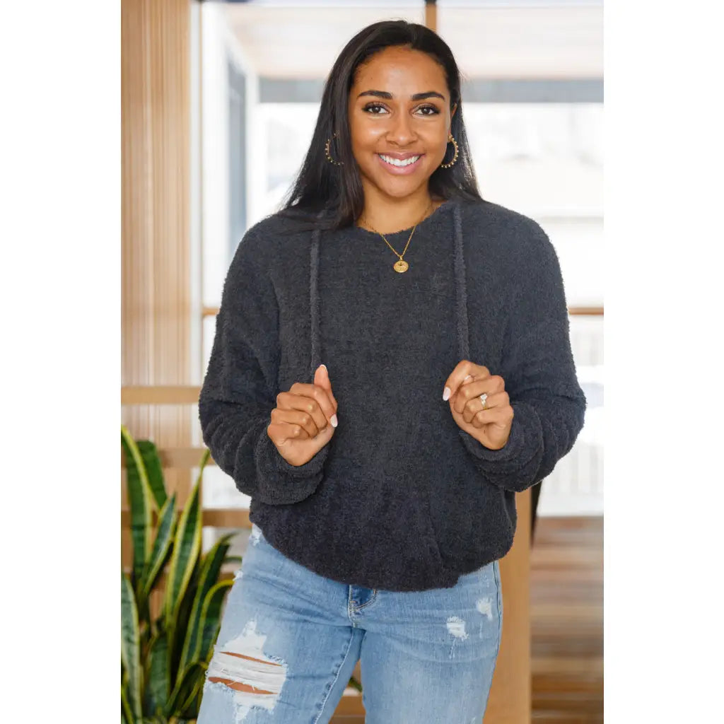 Our Cozy Does It Hoodie In Charcoal is so comfy! The coziness starts with a fuzzy medium weight knit that shapes slight