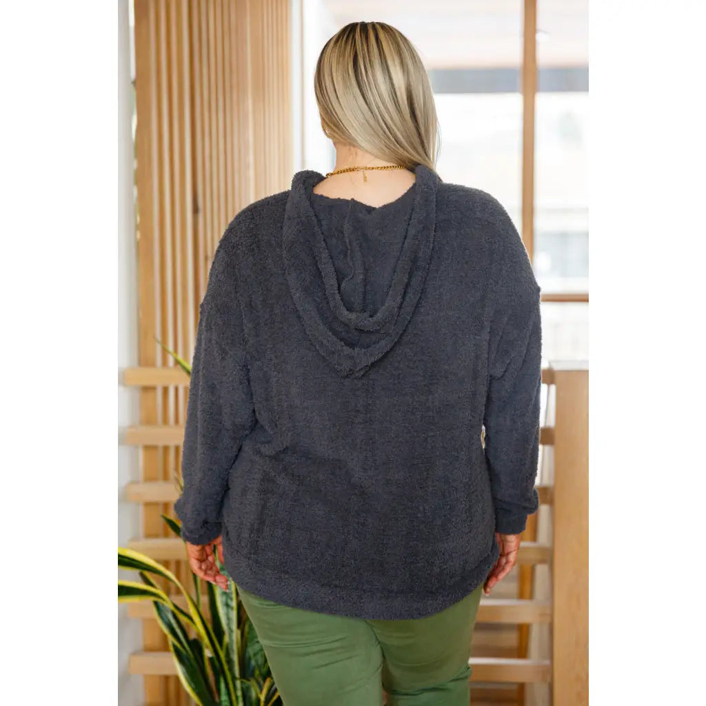 Our Cozy Does It Hoodie In Charcoal is so comfy! The coziness starts with a fuzzy medium weight knit that shapes slight