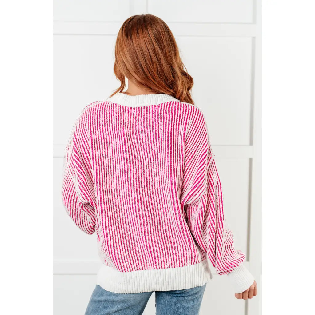 Our Cozy Oversized Contrast Trim Sweater in Pink and White features a textured knit banded ribbed details on the round