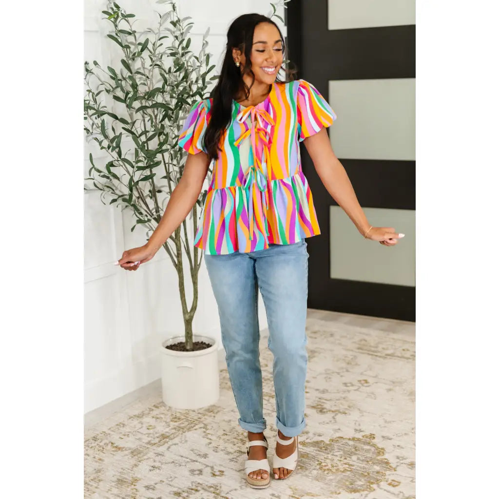 Bold swirl puff sleeve top in mint and orange. No-stretch woven fit with bows a gathered tier. Available regular plus