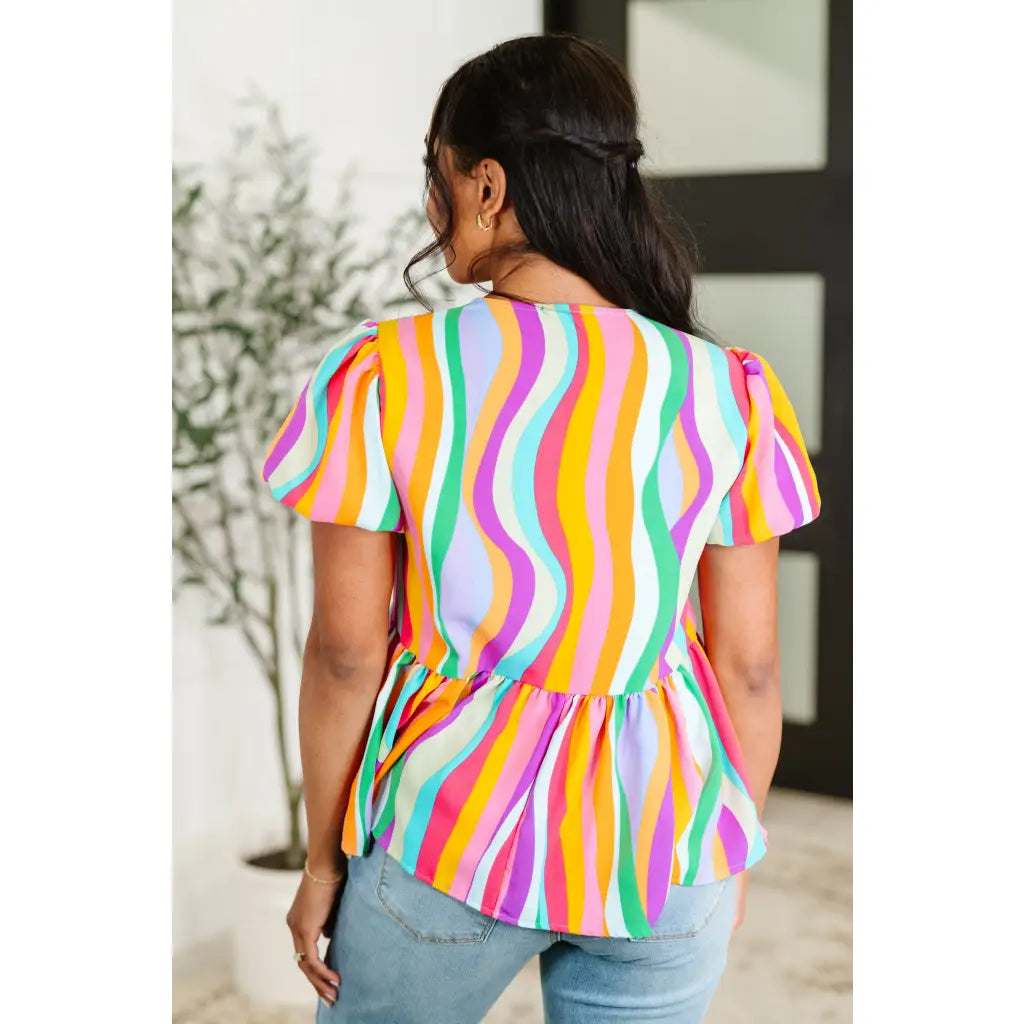 Bold swirl puff sleeve top in mint and orange. No-stretch woven fit with bows a gathered tier. Available regular plus