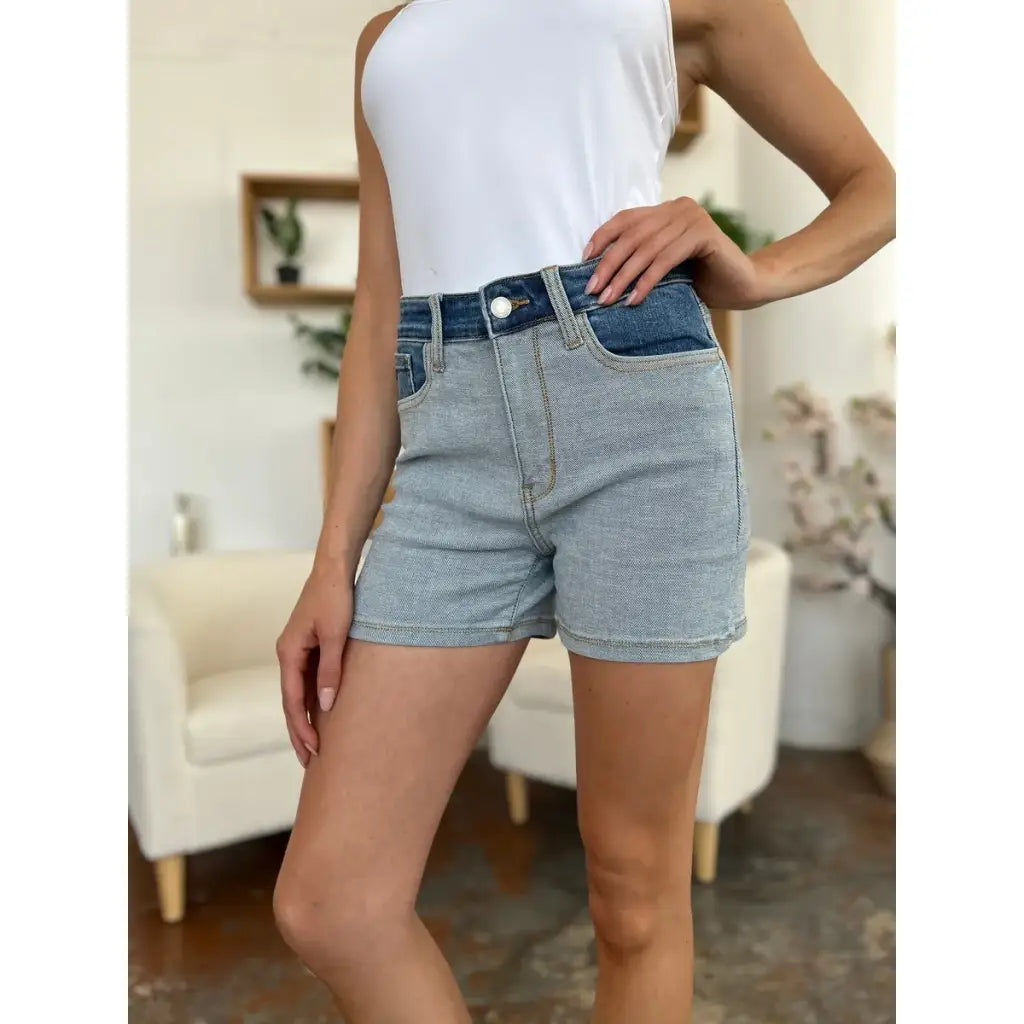 Two-tone Judy Blue denim shorts with color block detail and curve-hugging stretch. Plus size friendly perfect for bold