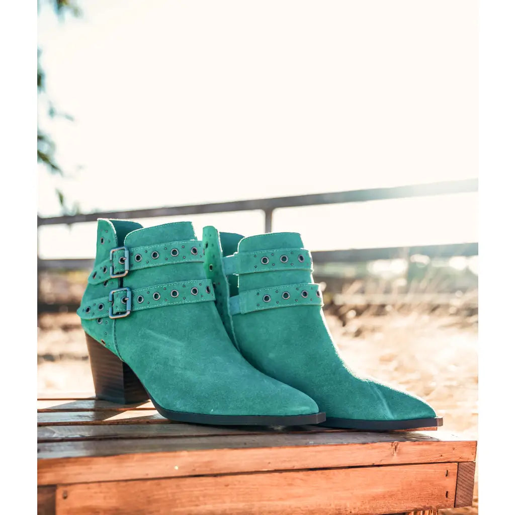 Make a statement with the Elsa Leather Ankle Boot in Teal! Genuine suede stylish hardware and cushioned comfort.