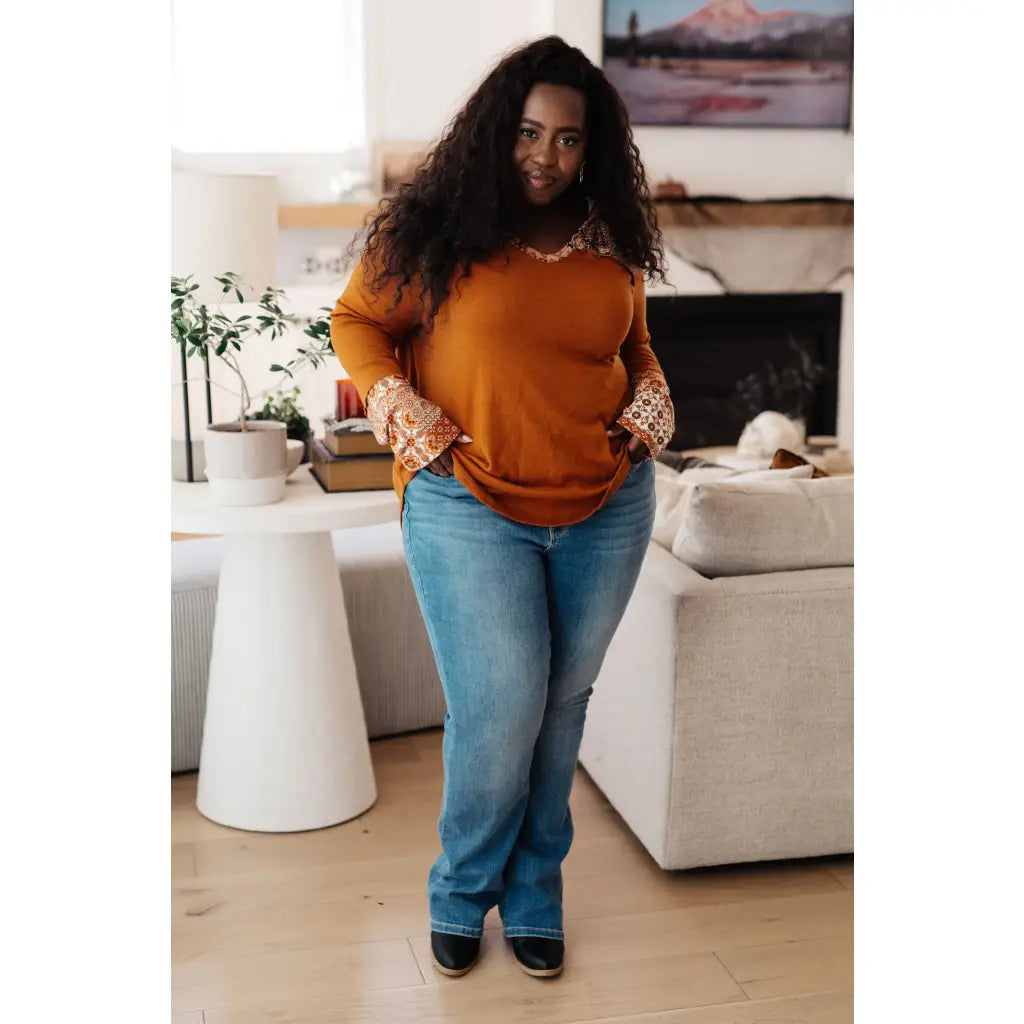 Our Fall Floral Mixed Print Hoodie features a rust colored brushed knit with patterned bulgari accents design.