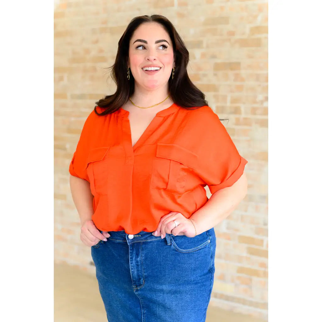 Bold and fun blouse in tomato red with flap pockets cuffed sleeves. A lightweight go-to for regular curvy or plus