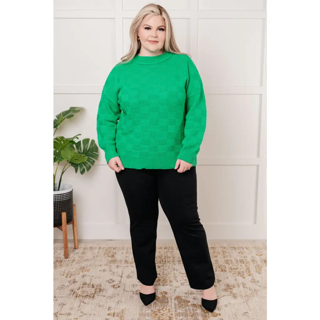 Our Green on Checked Sweater is a playful pullover made with cozy knit material. It features round ribbed neckline long
