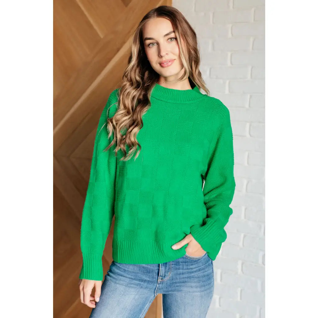 Our Green on Checked Sweater is a playful pullover made with cozy knit material. It features round ribbed neckline long