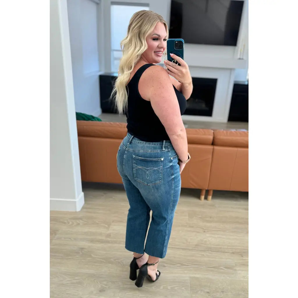 Discover effortless style with our Hayes High Rise Wide Leg Crop Jeans. This medium wash 4 way stretch denim is cut