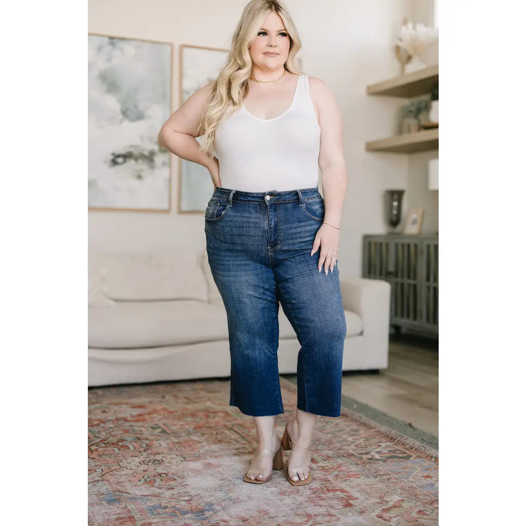 Discover effortless style with our Hayes High Rise Wide Leg Crop Jeans. This medium wash 4 way stretch denim is cut