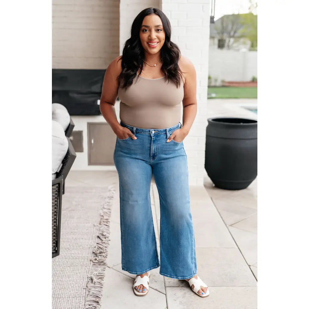 Discover effortless style with our Hayes High Rise Wide Leg Crop Jeans. This medium wash 4 way stretch denim is cut