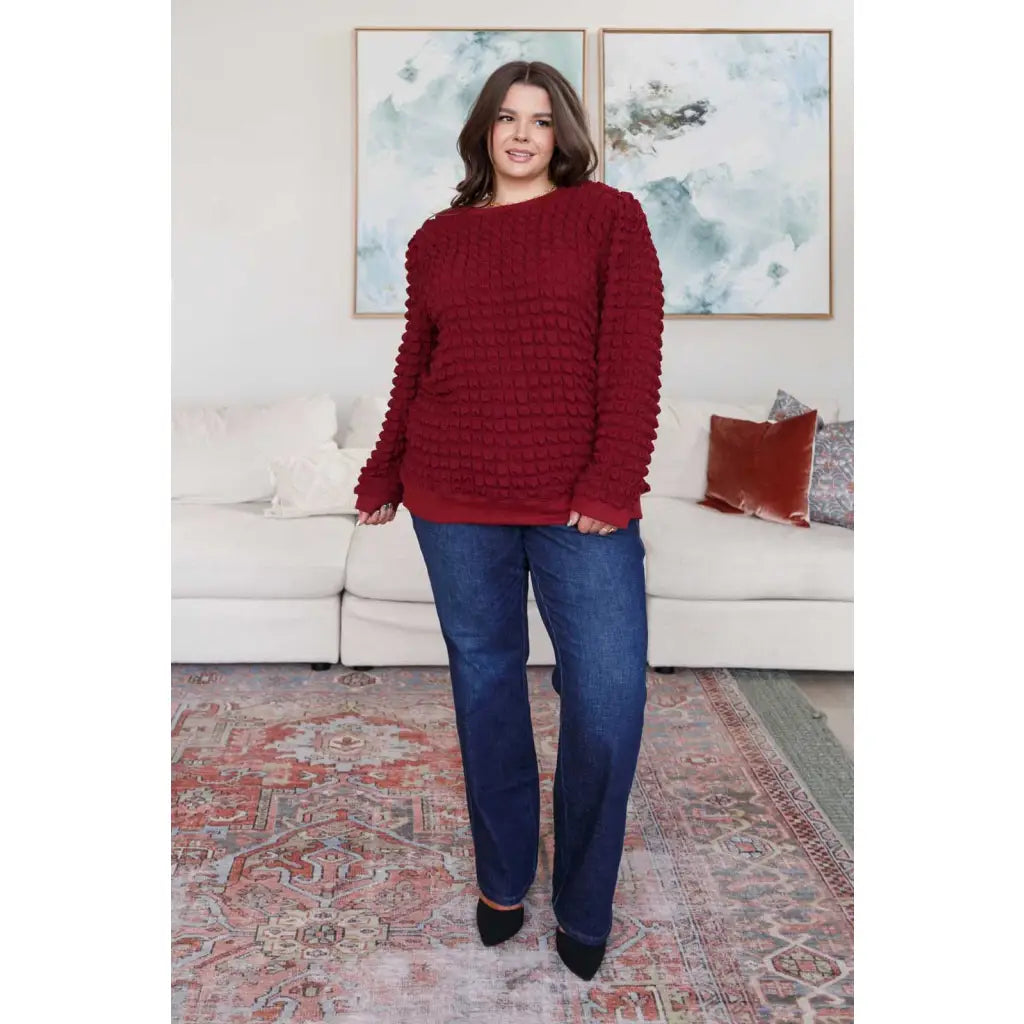 Our In Denial Bubble Pullover Top in Maroon will elevate any wardrobe! Showcase your trendy style with the shoulder
