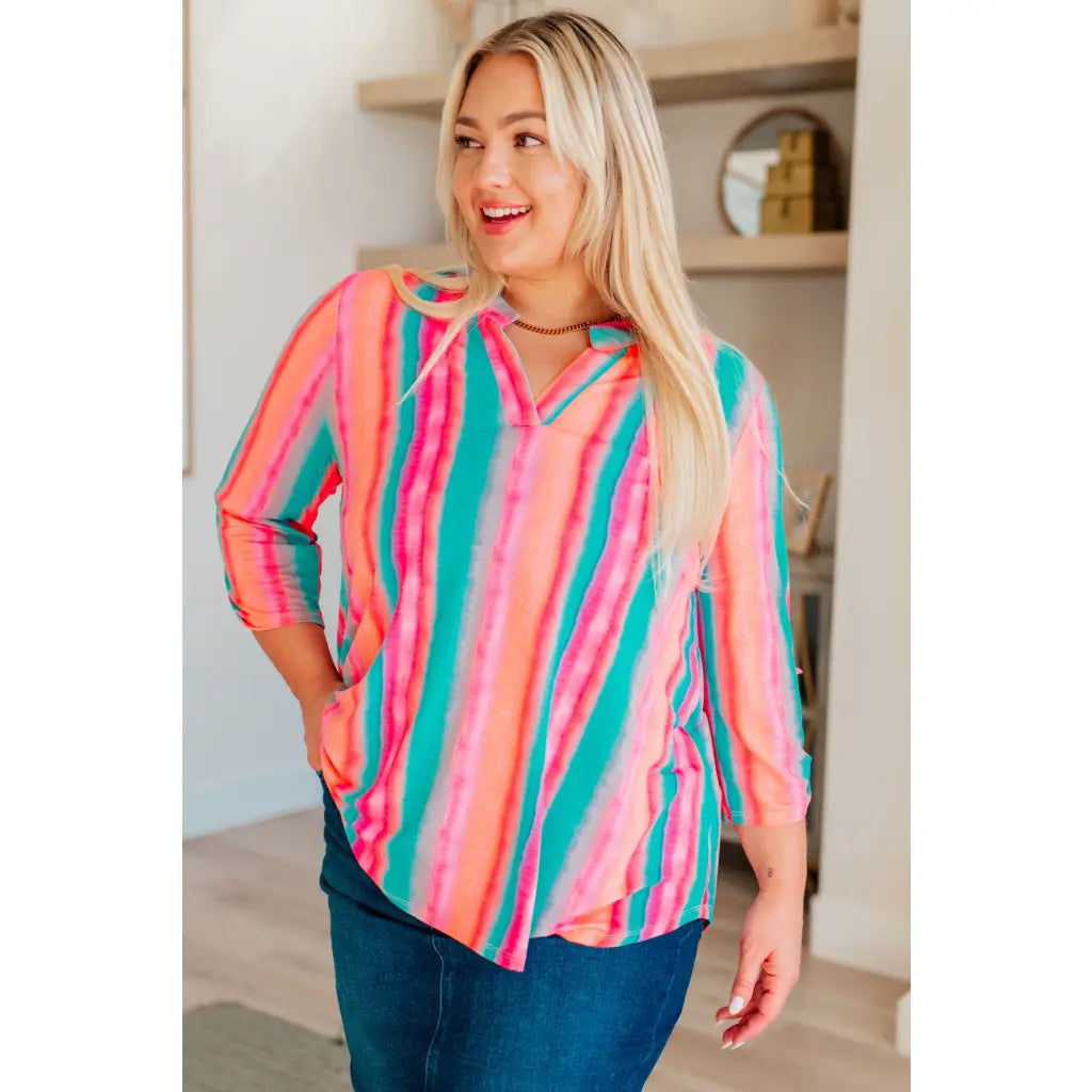 Transform your closet with our Lizzy Top in Ombre Mint Stripe. Made from wrinkle-free and stretchy Bulgari fabric