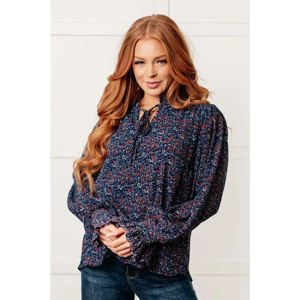 Add a touch of dreamy romance with our Lucid Dream Ruffle Neckline Blouse in Navy. Made crinkle woven fabric ditsy