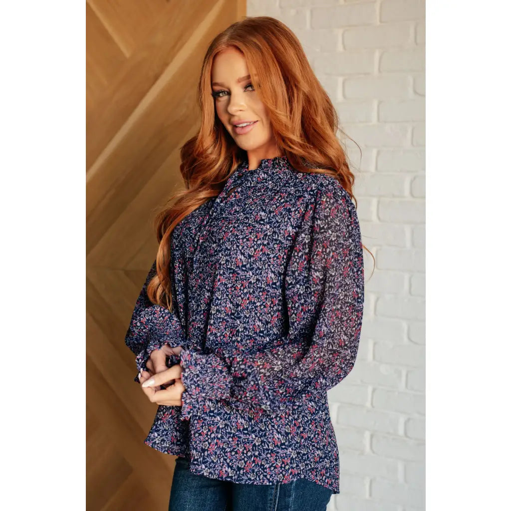 Add a touch of dreamy romance with our Lucid Dream Ruffle Neckline Blouse in Navy. Made crinkle woven fabric ditsy
