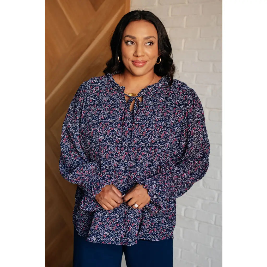 Add a touch of dreamy romance with our Lucid Dream Ruffle Neckline Blouse in Navy. Made crinkle woven fabric ditsy