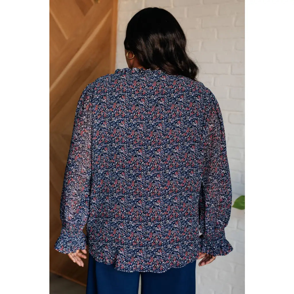 Add a touch of dreamy romance with our Lucid Dream Ruffle Neckline Blouse in Navy. Made crinkle woven fabric ditsy