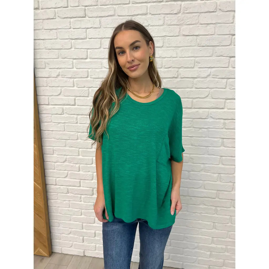 Flow effortlessly in the Lucky Breeze Dolman Sleeve Top Kelly Green! Oversized and ultra-comfy with dolman sleeves.