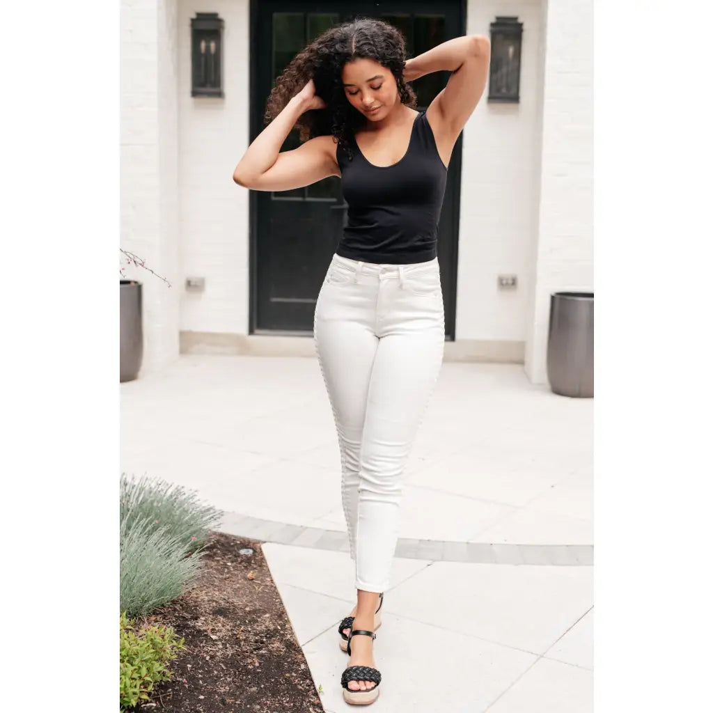 Shop Maddie Mid Rise Braided Side Seam Jeans from Judy Blue. Crisp white denim 4-way stretch braided detail relaxed