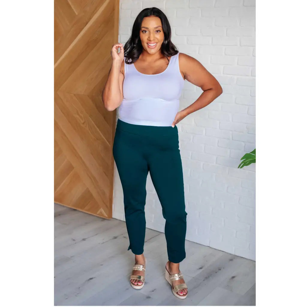 Our Magic Skinny Pants in Hunter Green are high rise ankle cropped pants featuring a slim fit and ponte knit