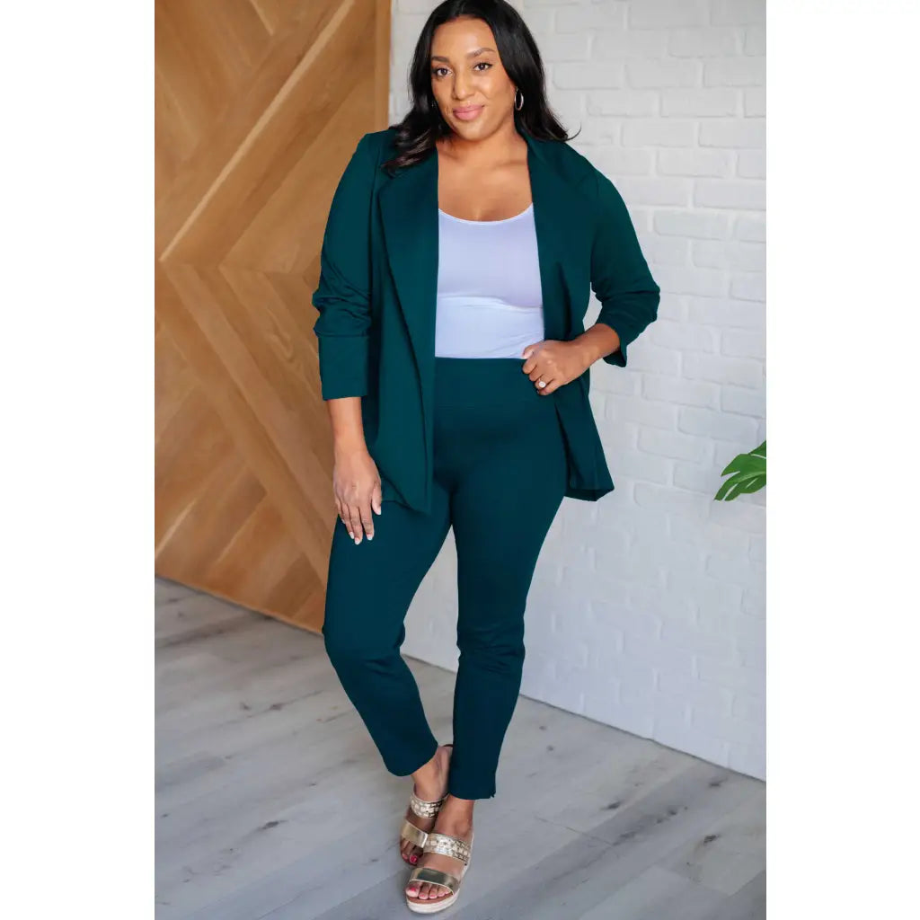 Our Magic Skinny Pants in Hunter Green are high rise ankle cropped pants featuring a slim fit and ponte knit