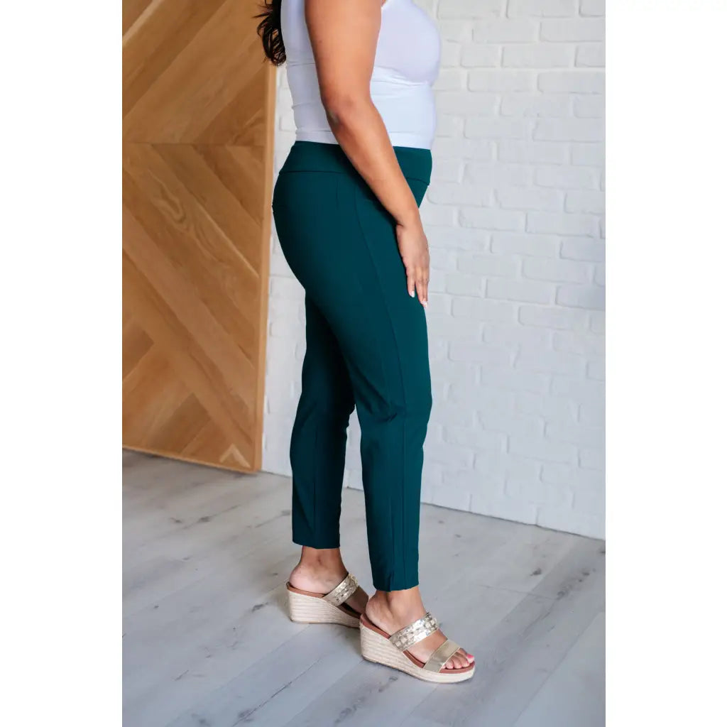 Our Magic Skinny Pants in Hunter Green are high rise ankle cropped pants featuring a slim fit and ponte knit