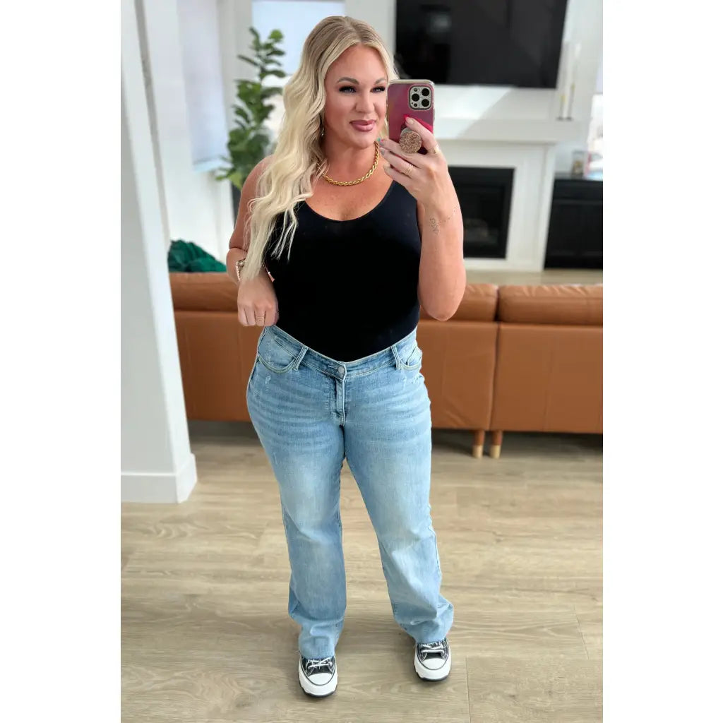 Get ready to redefine your denim game with our Mildred High Rise V Front Waistband Straight Jeans from Judy Blue!
