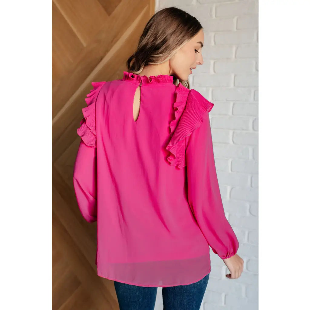 Discover the My Good Graces Ruffled Blouse a romantic pink mock neck top with balloon sleeves. Plus it’s available