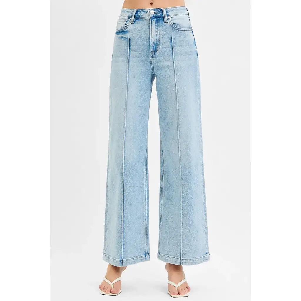 Chic pintuck detailed wide leg jeans with high waist stretch comfort and modern style. Elevated everyday stretchy denim