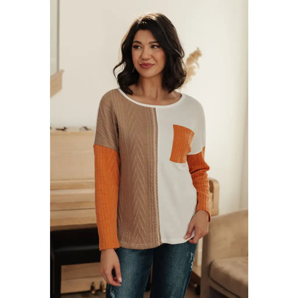 Colorblock knit top with pumpkin orange latte brown and cream panels. Boutique fall essential! SM-3XL a relaxed fit