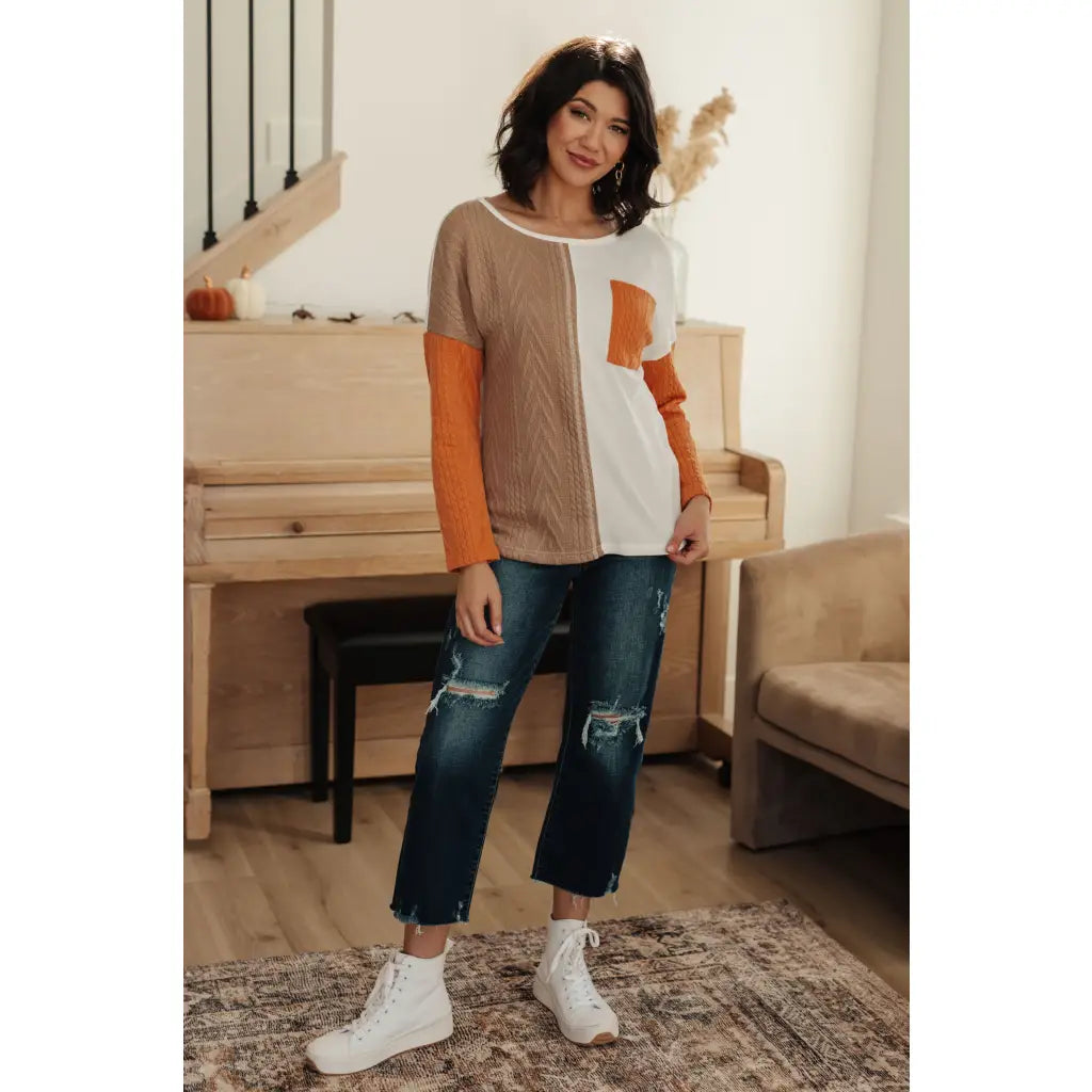 Colorblock knit top with pumpkin orange latte brown and cream panels. Boutique fall essential! SM-3XL a relaxed fit