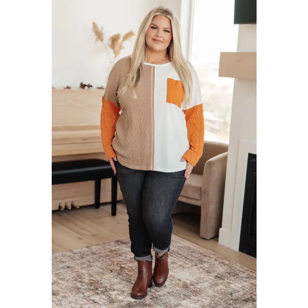 Colorblock knit top with pumpkin orange latte brown and cream panels. Boutique fall essential! SM-3XL a relaxed fit
