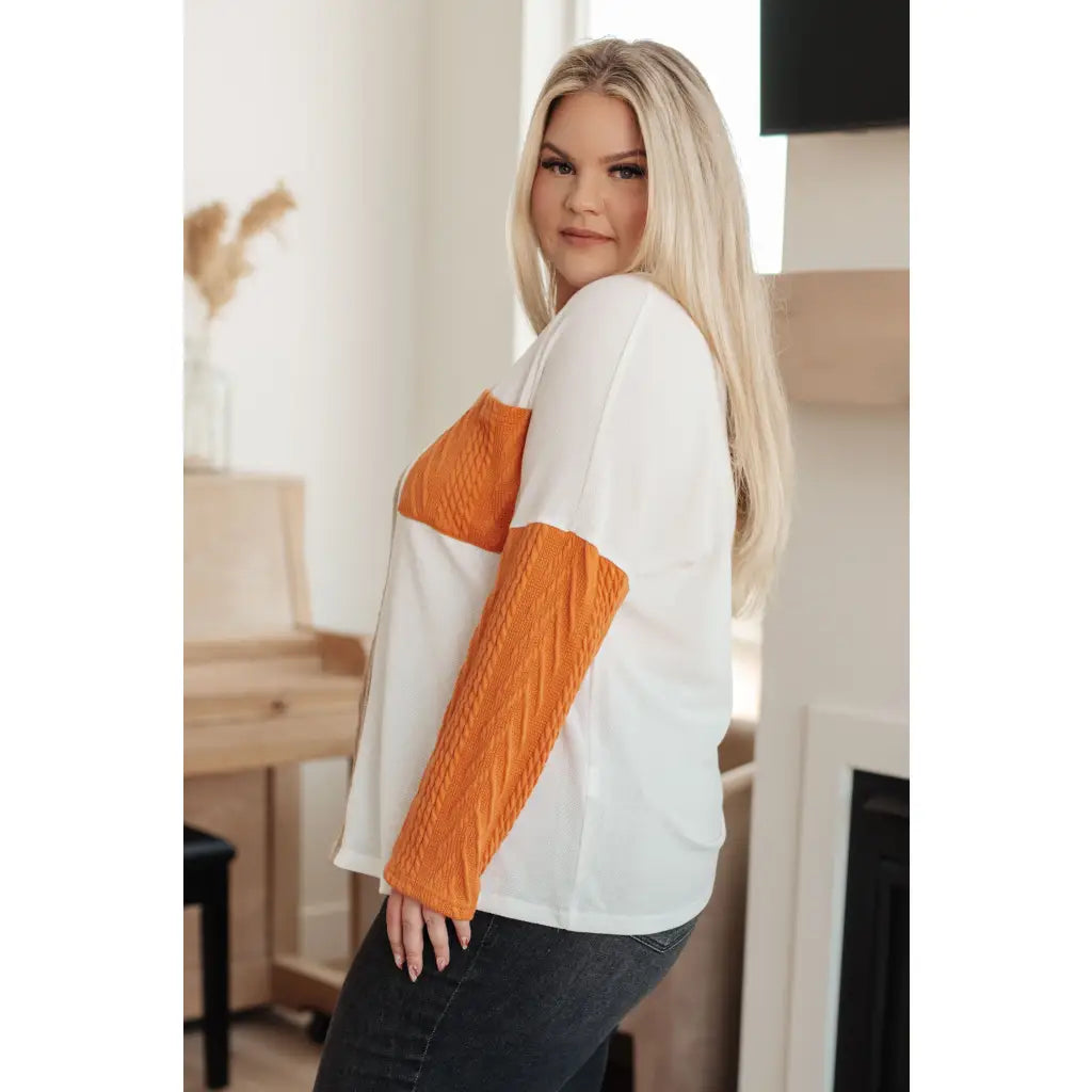 Colorblock knit top with pumpkin orange latte brown and cream panels. Boutique fall essential! SM-3XL a relaxed fit