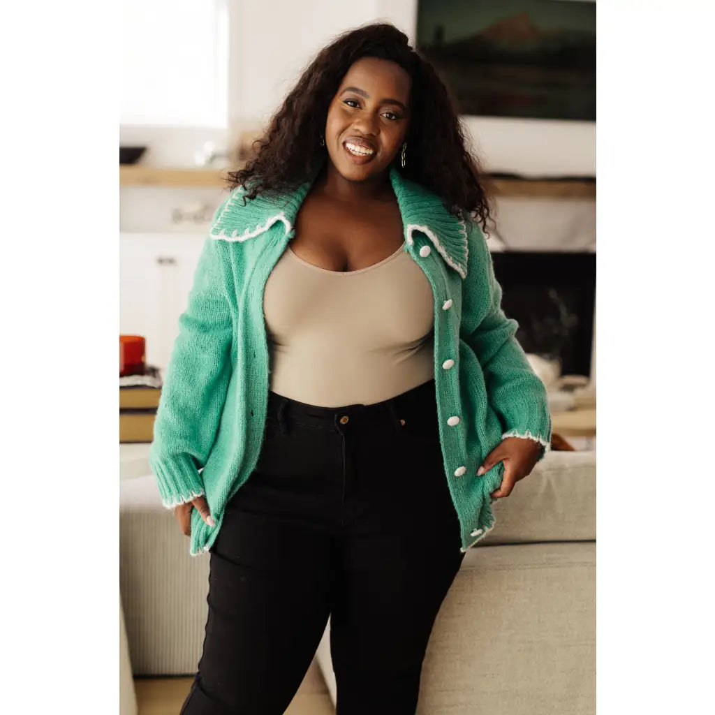 Our relaxed and cozy Ready for Surprises Cardigan features a soft green sweater knit exaggerated shawl collar contrast